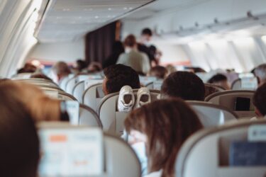 People travelling in an airplane scaled