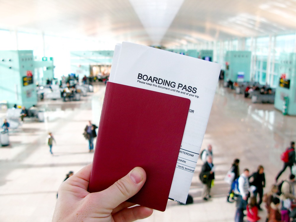 Passport and boarding pass, waiting for a flight in a modern airport. What is advance parole?